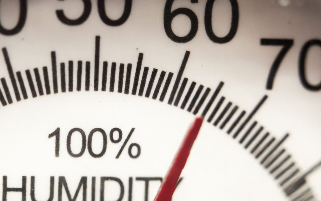 Close-up humidity gauge showing a high relative humidity reading